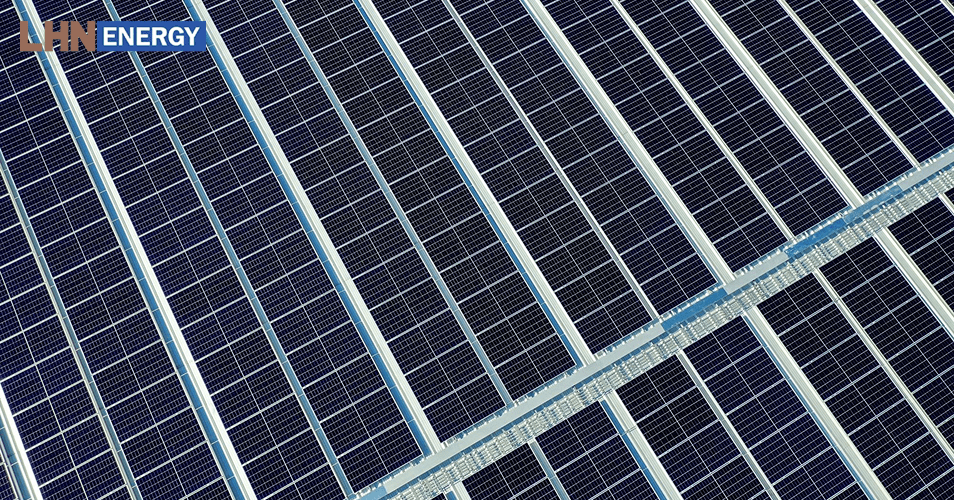 Rows of polycrystalline solar panels for a business rooftop installation.